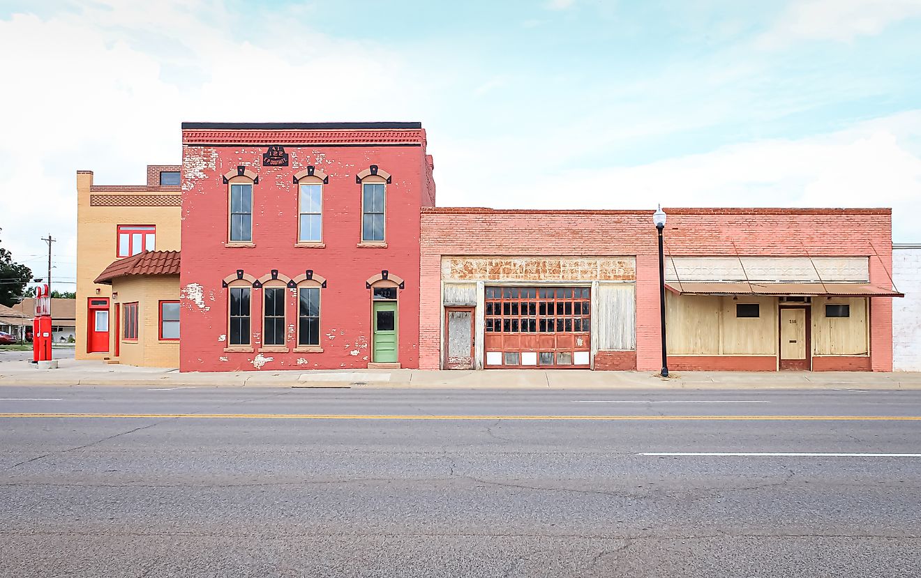 A colorful street corner with abandoned buildings in Oklahoma.