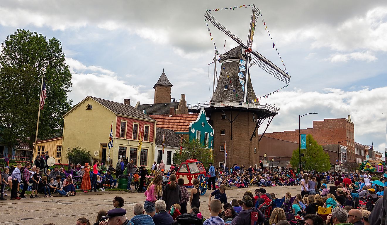 People celebrating the Tulip Time Festival in Pella, Iowa. Image credit yosmoes815 via Shutterstock