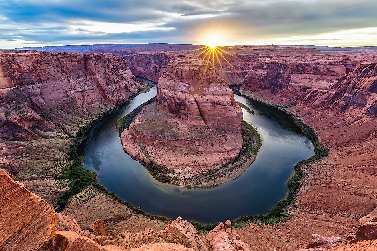 Horseshoe Bend at sunset. The hairpin turn taken by the Colorado River in Arizona's Glen Canyon National Recreation Area is close to Lake Powell and Page, AZ.