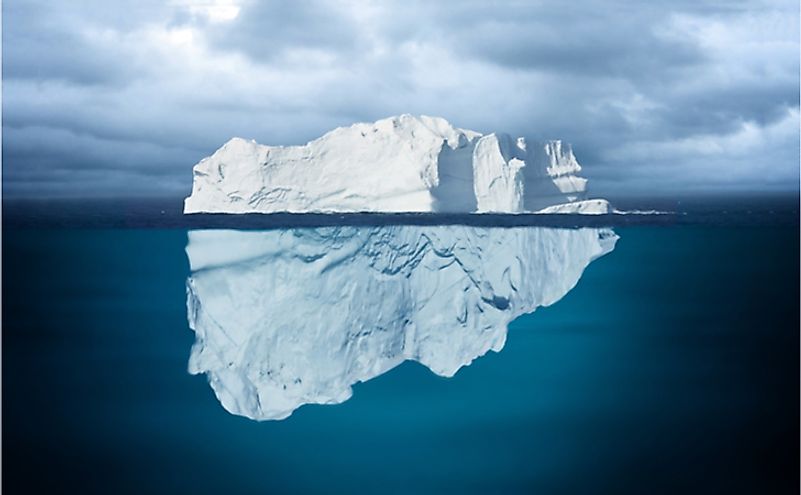 The greater mass of the iceberg floats below water.