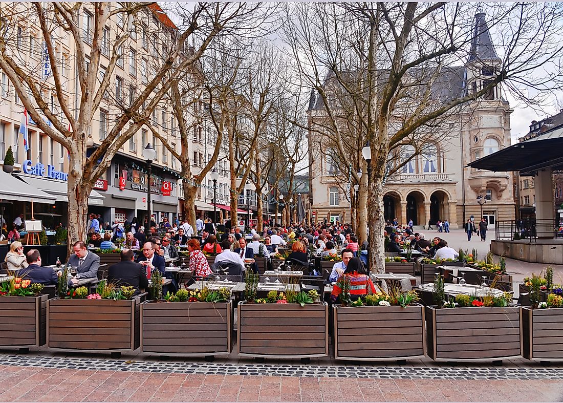 People sit in Luxembourg City, Luxembourg. Editorial credit: elvisvaughn / Shutterstock.com.