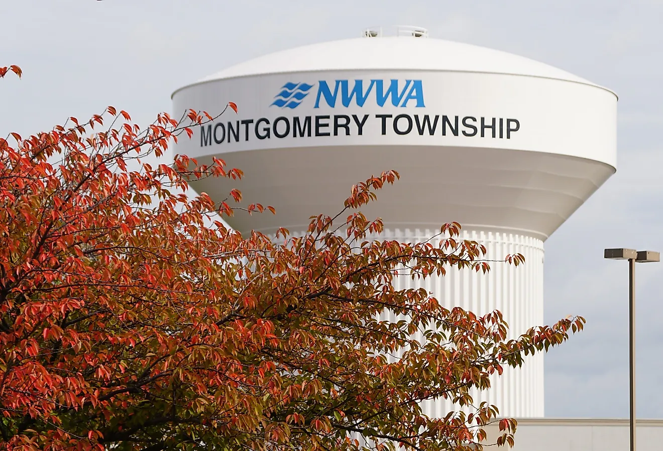 The water tower of NWWA Montgomery Township with the fall foliage, Pennsylvania. Image credit Khairil Azhar Junos via Shutterstock