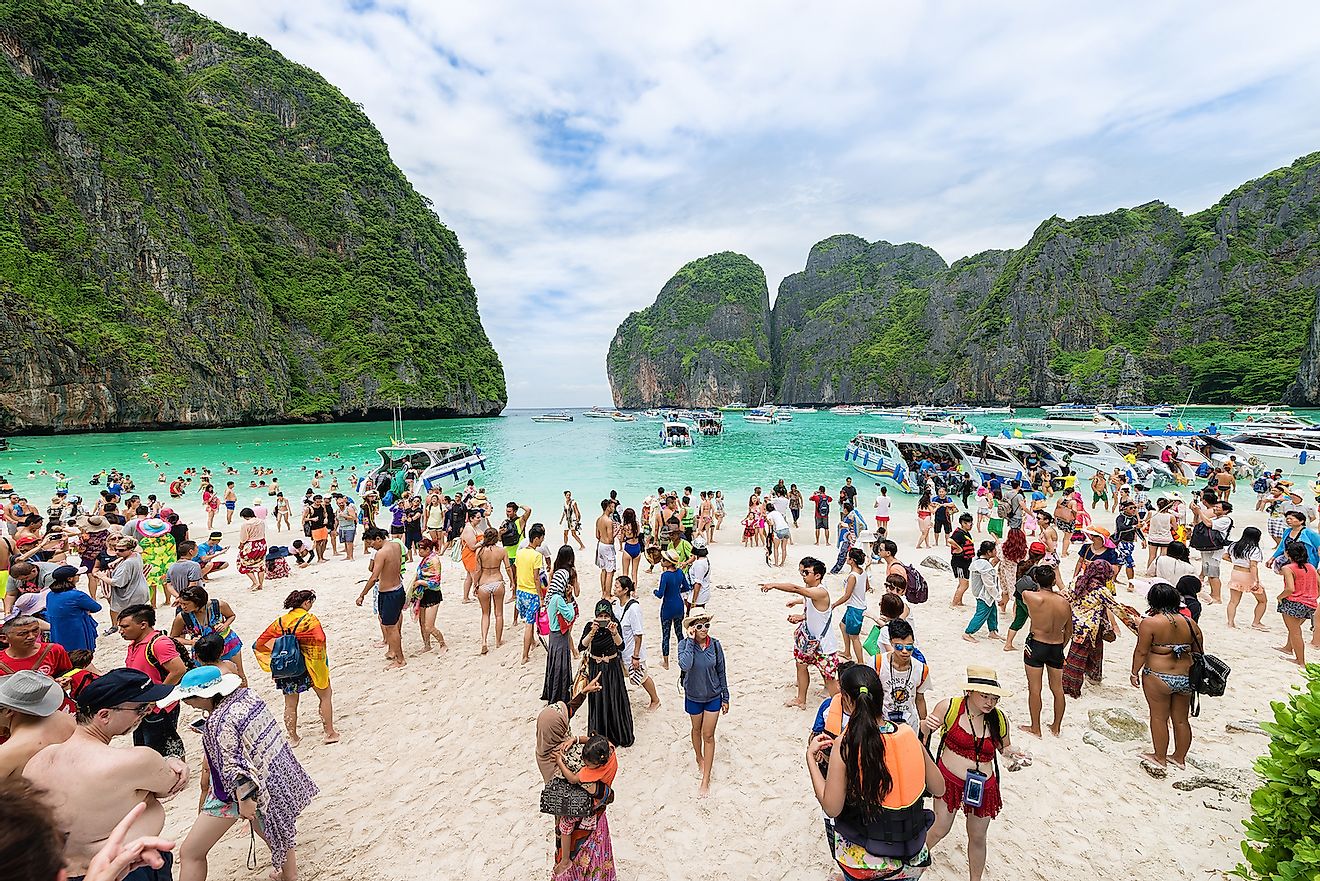 A crowded beach in Phi Phi Island, Thailand. Image credit: Avatar_023/Shutterstock.com
