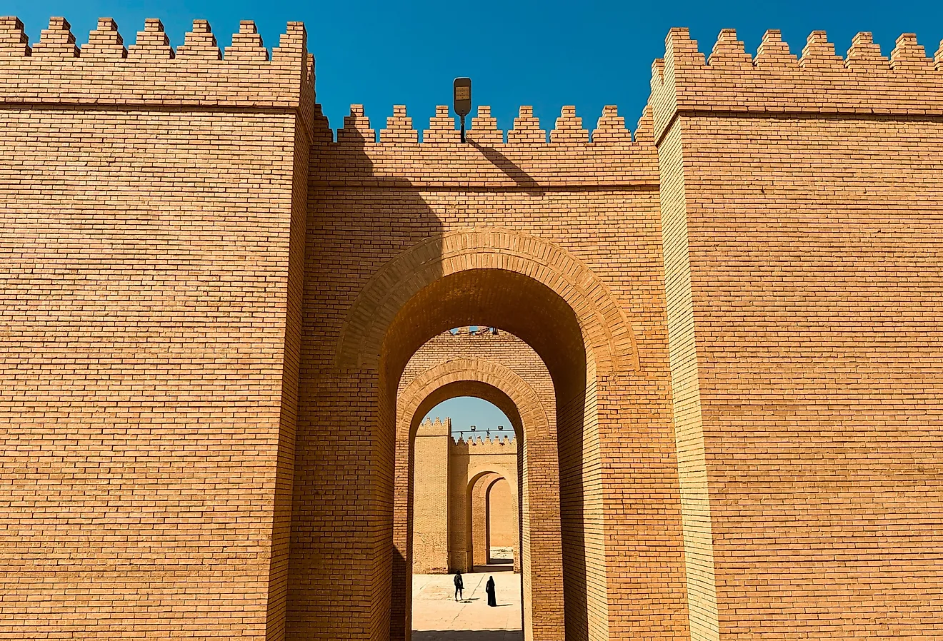 Exploring the ancient ruins of Babylon in Iraq with impressive brick architecture.