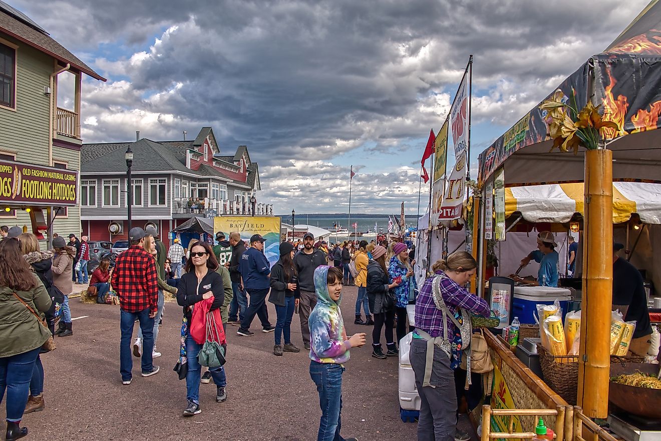 People enjoying the Annual Applefest in Bayfield, Wisconsin, USA, with colorful stalls and a festive atmosphere. Editorial credit: Jacob Boomsma / Shutterstock.com