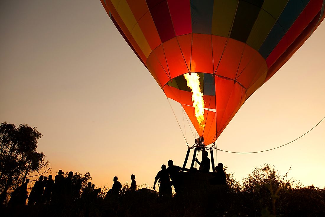 Hot air balloons are kept afloat by burning gasses. 