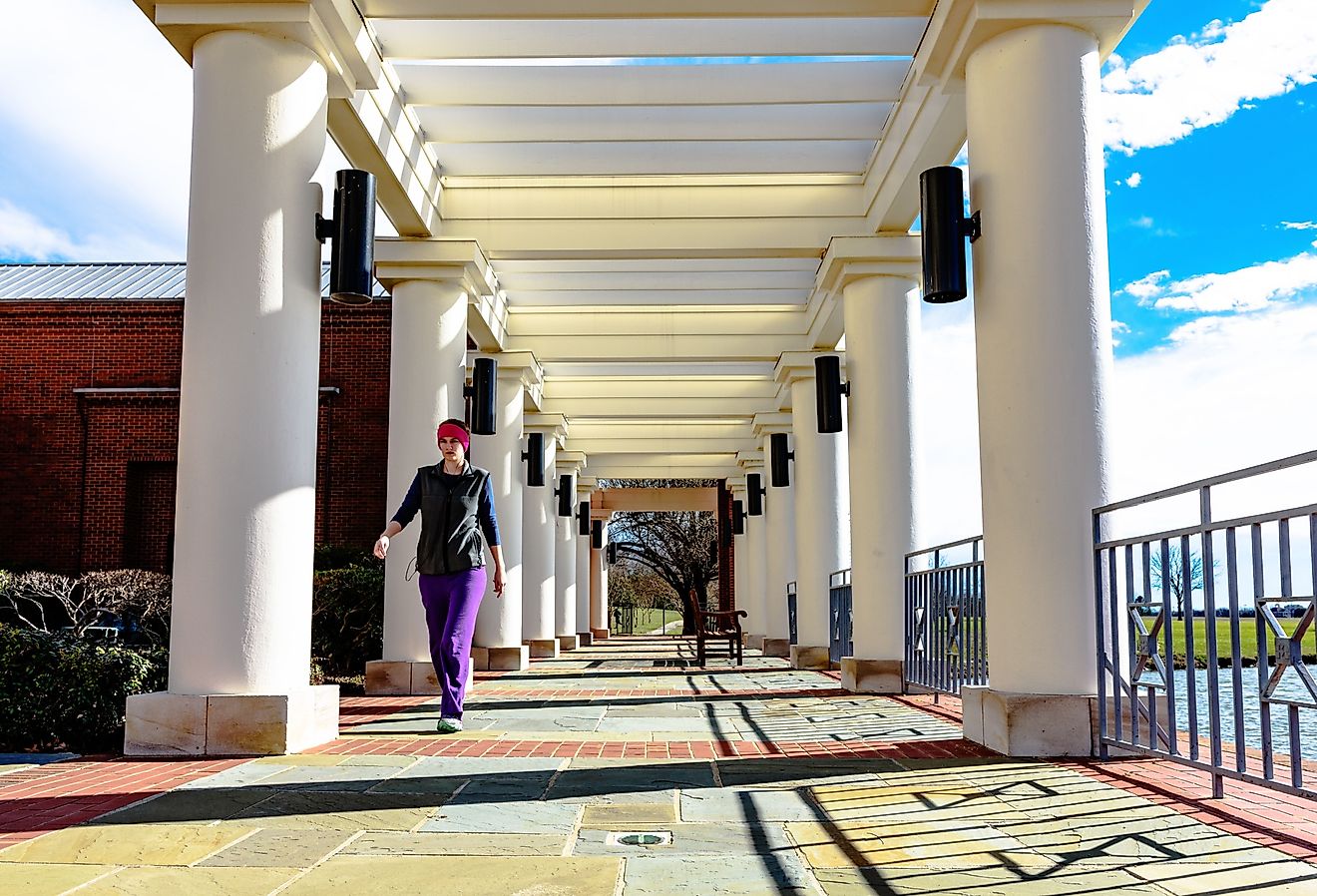 Woman walks through the open veranda at the Montgomery Museum of Fine Arts on a brisk winter day. Editorial credit: JNix / Shutterstock.com