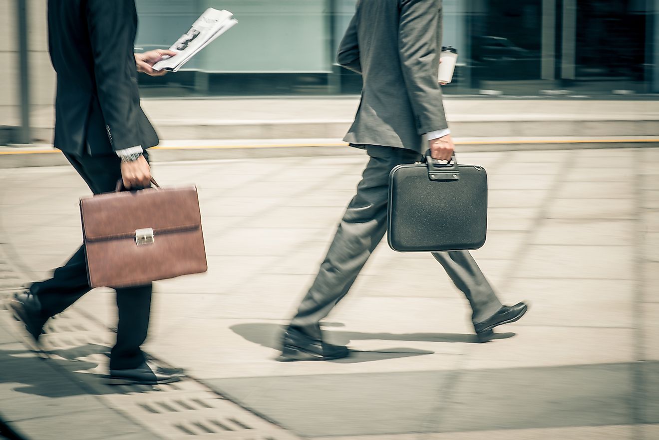 Men walking to workplace. Image credit: Dragon Images/Shutterstock.com
