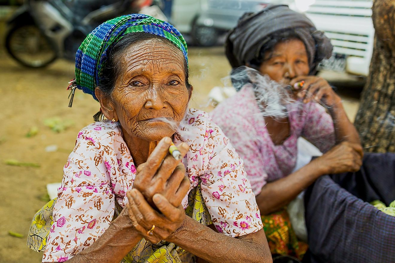 Women smoking tobacco in Myanmar.