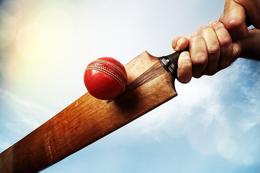 A cricket bat and ball. 