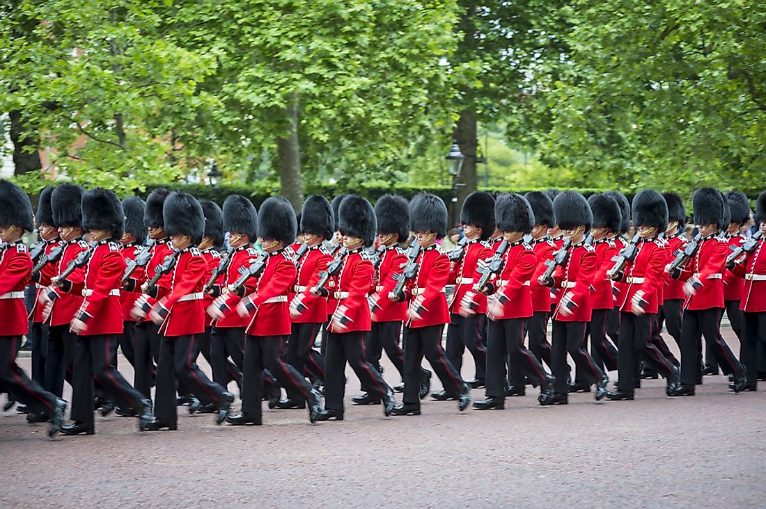 Troops march in the Trooping the Colour ceremony for the Queen. Editorial credit: lazyllama / Shutterstock.com