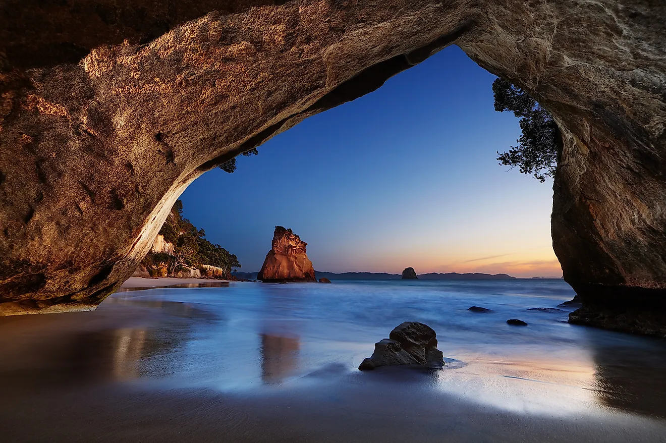 Cathedral Cove at sunrise, Coromandel Peninsula, New Zealand. Image credit: Dmitry Pichugin/Shutterstock.com