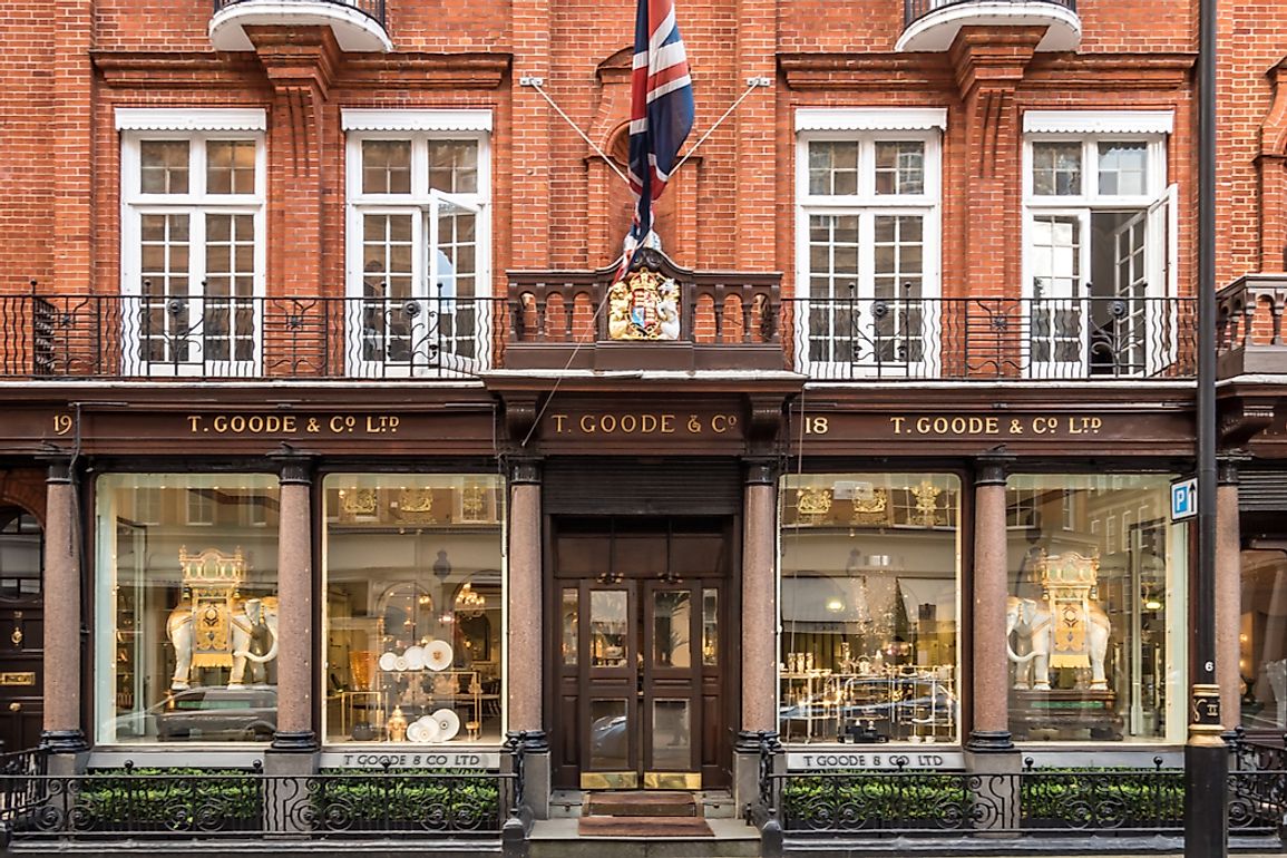 T. Goode & Co. Ltd. in Mayfair, London displays the Royal Coat of Arms above the doorway to signal their Royal Warrant. Editorial credit: pxl.store / Shutterstock.com