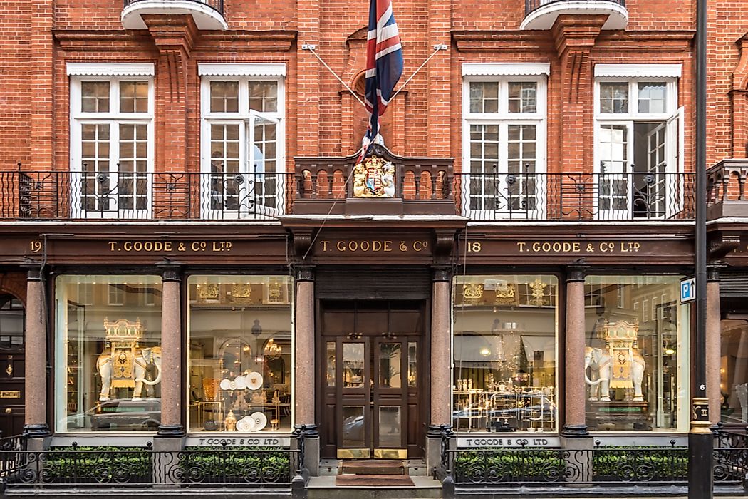 T. Goode & Co. Ltd. in Mayfair, London displays the Royal Coat of Arms above the doorway to signal their Royal Warrant. Editorial credit: pxl.store / Shutterstock.com