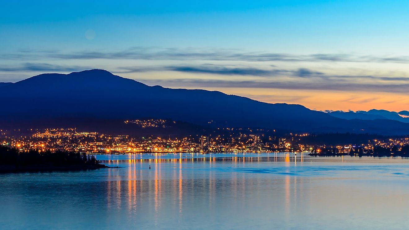 Tranquil sunset and evening illuminations of the beautiful town of Nanaimo on Pacific Ocean in Vancouver, Canada. Image credit: karamysh/Shutterstock.com