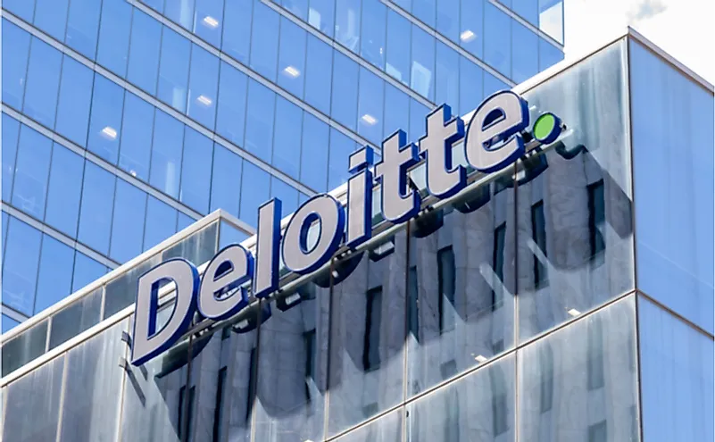 Deloitte sign on the national office building in Toronto. Editorial credit: JHVEPhoto / Shutterstock.com