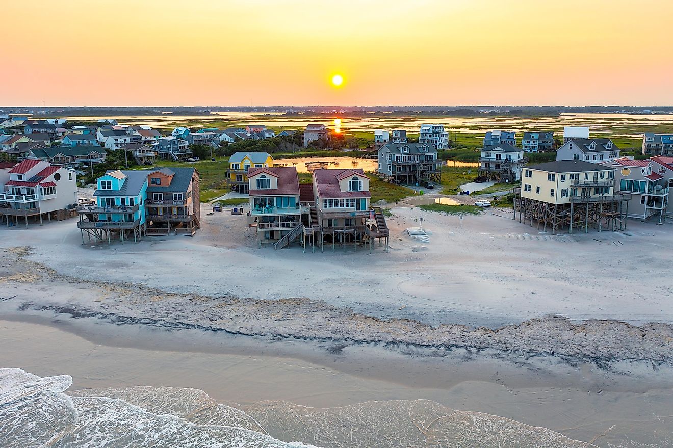Aerial View of Beach Homes Right on the Shoreline and Marshland in North Topsail Beach at Sunset.