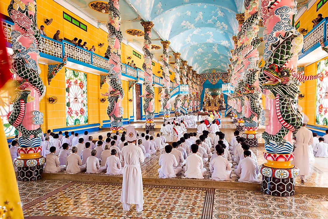 Beautiful interior of the central home and Holy See of the Cao Dai faith in Tay Ninh, Vietnam. Editorial credit: R.M. Nunes / Shutterstock.com.