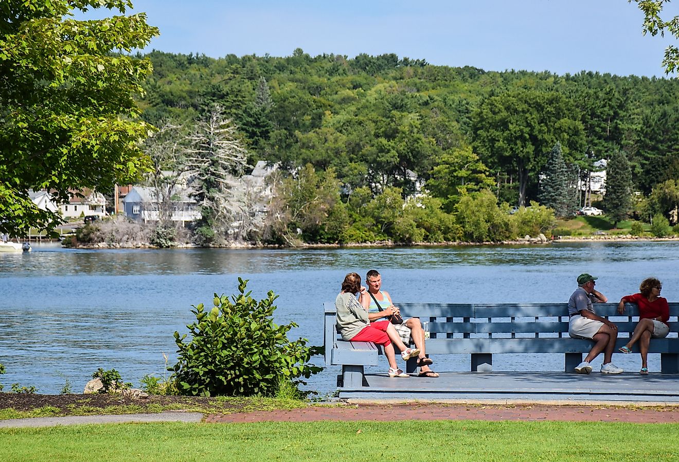 The picturesque embankment of Lake Winnipesok in Meredith, New Hampshire. Image credit Konoplytska via Shutterstock.