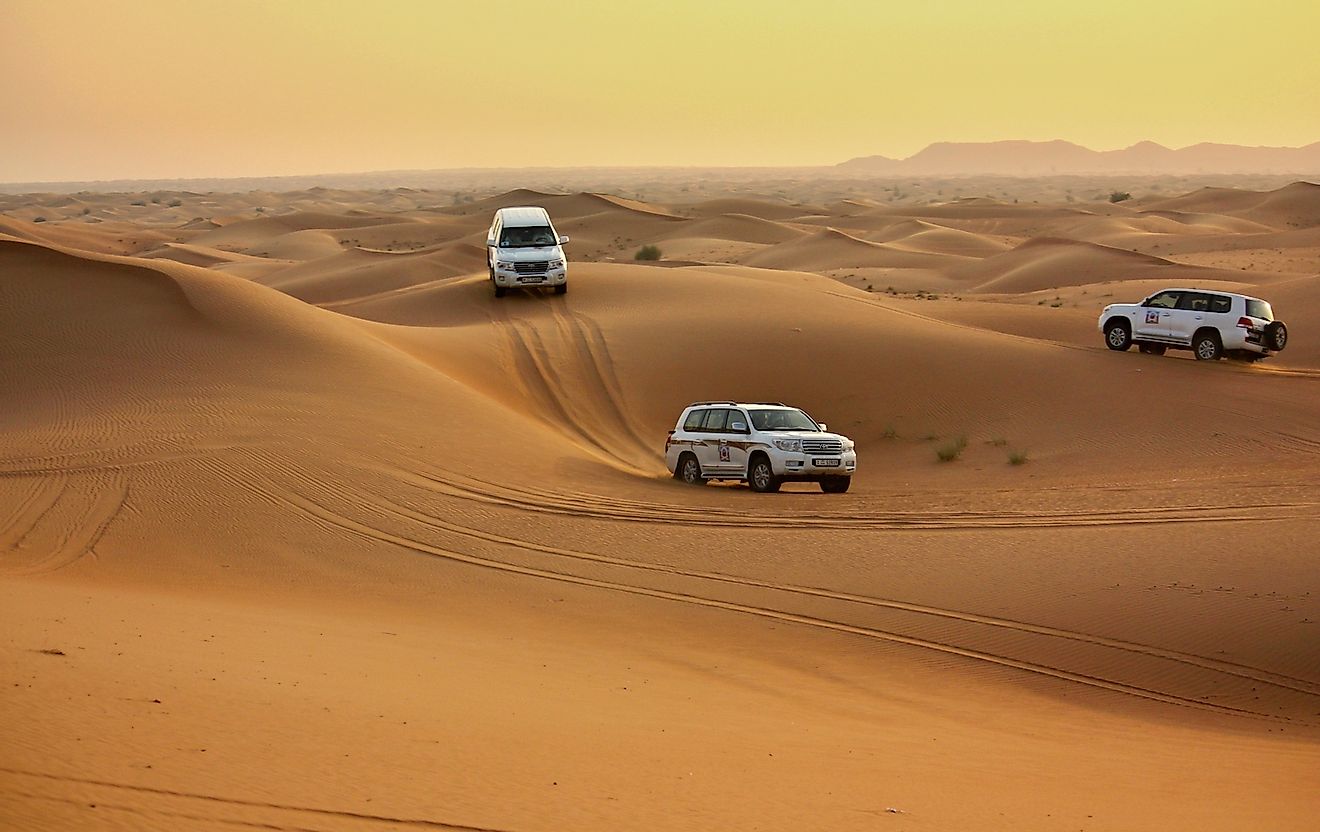 Driving in jeeps in the Pink Rock Desert, Sharjah, UAE. Image credit: Islavicek/Shutterstock.com
