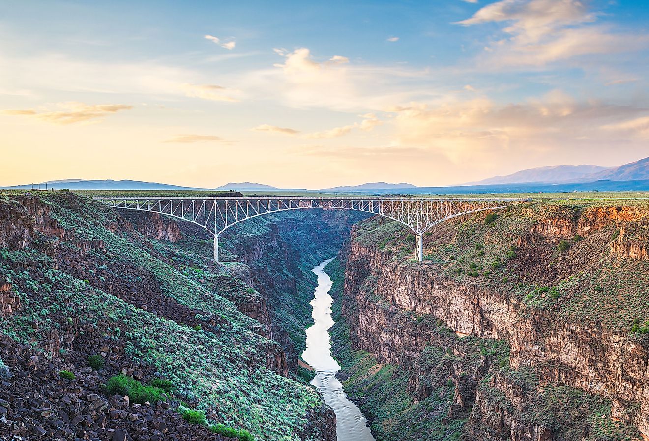 Taos, New Mexico, US at Rio Grande Gorge Bridge over the Rio Grande at dusk. Image credit Sean Pavone via Shutterstock