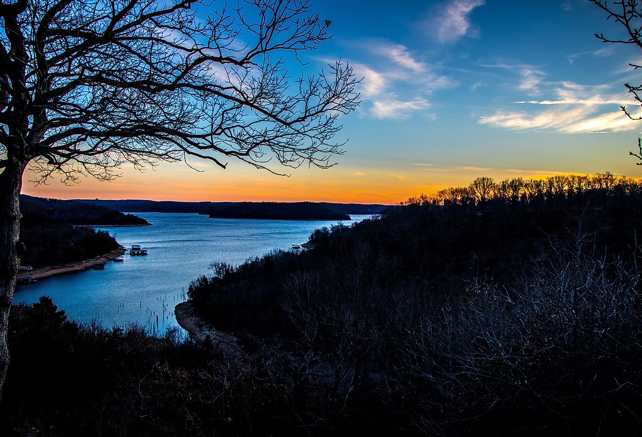 Eureka Springs, Arkansas sunset on the lake from a mountaintop. Image credit Fluffy Watson via Shutterstock.