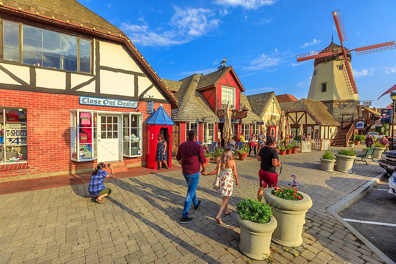 Solvang's main street bustling with people, Santa Barbara County, California. Historic Danish village backdrop, featuring an old windmill. Editorial credit: Benny Marty / Shutterstock.com