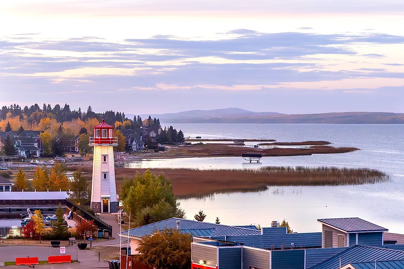 Lighthouse and shoreline at sunset in Sylvan Lake, Alberta, Canada.