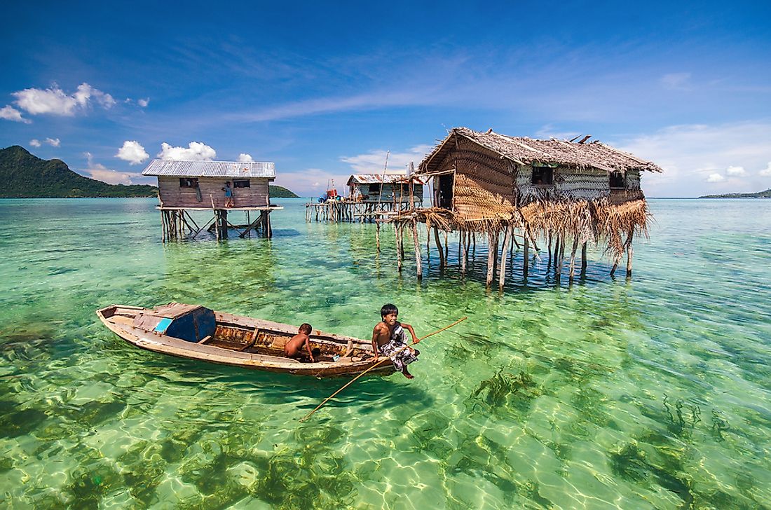 Some Bajau Laut live in stilt houses in coastal shallows while others live on their boats. Editorial credit: muhd fuad abd rahim / Shutterstock.com