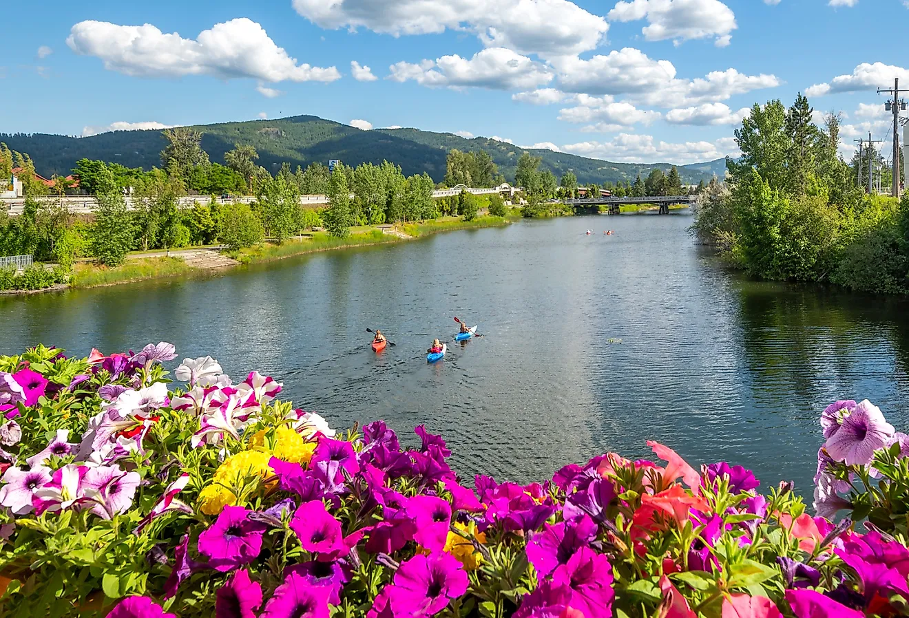 Kayakers enjoy a summer day on Sand Creek River and Lake Pend Oreille in the downtown area of Sandpoint, Idaho. Image Credits: Kirk Fisher via Shutterstock