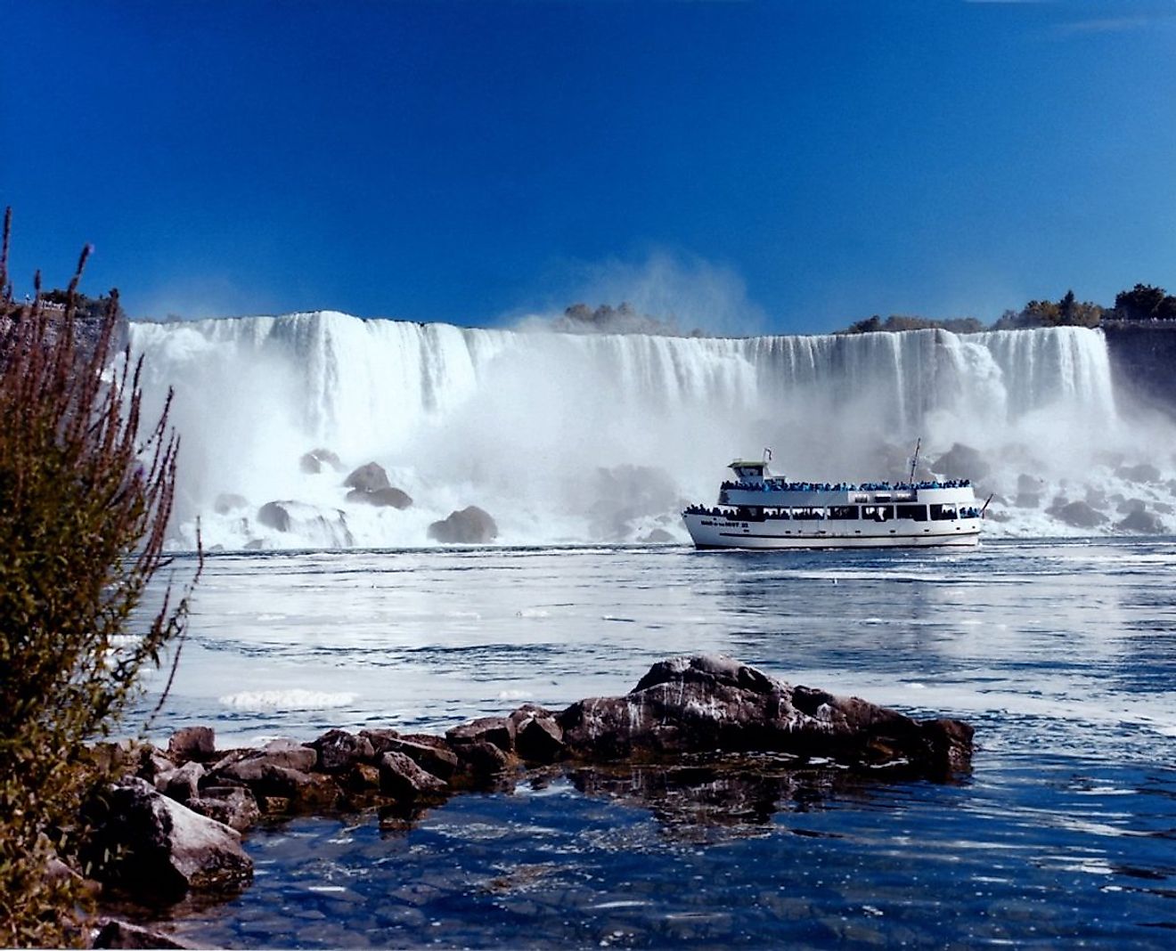 The Maid of the Mist traveling past the American Falls.
