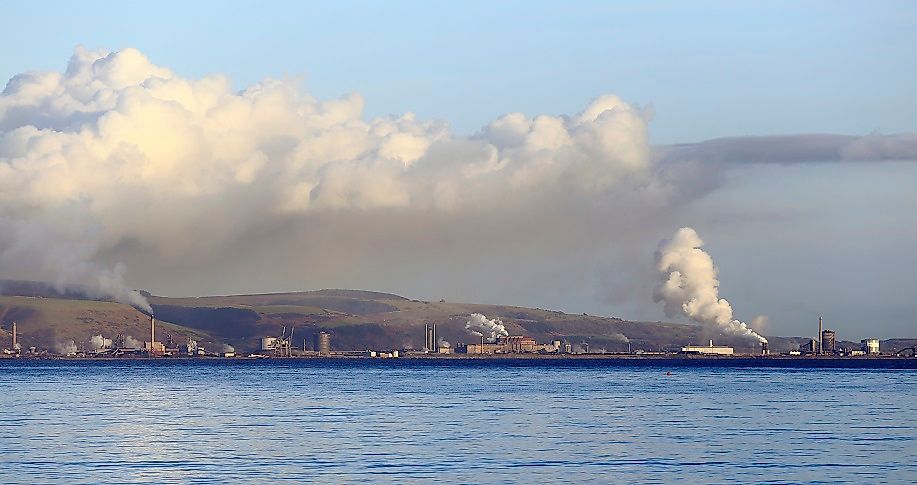 Plumes of smoke rise from coal-fired steel mills in Port Talbot, Wales, United Kingdom.