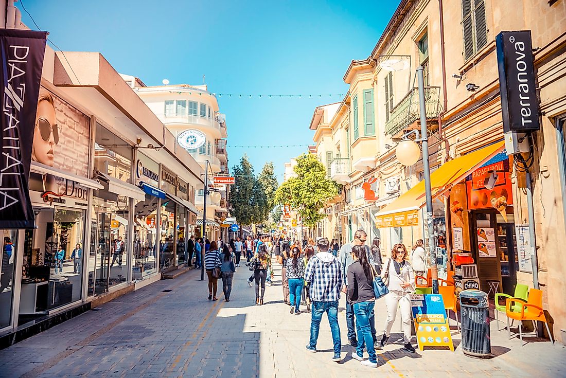 People walk down the street in Nicosia, Cyprus. Editorial credit: kirill_makarov / Shutterstock.com.