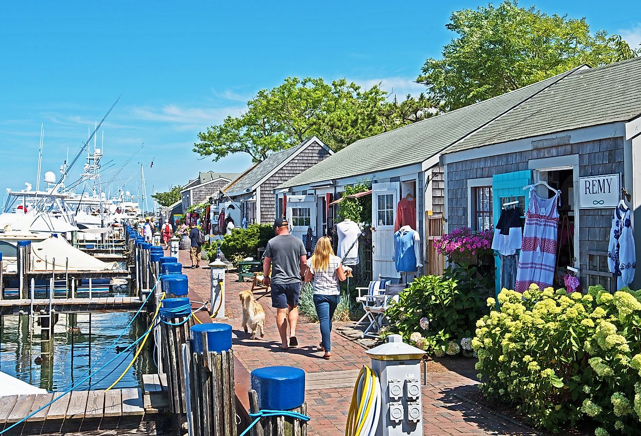 A row of eclectic stores next to the harbor in Nantucket, Massachusetts. Image credit Mystic Stock Photography via Shutterstock