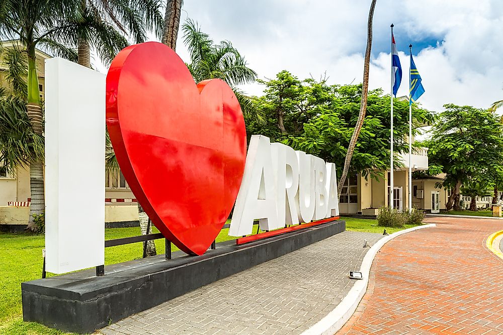 Sign outside of the parliament buildings in Aruba. Editorial credit: Mihai_Andritoiu / Shutterstock.com.