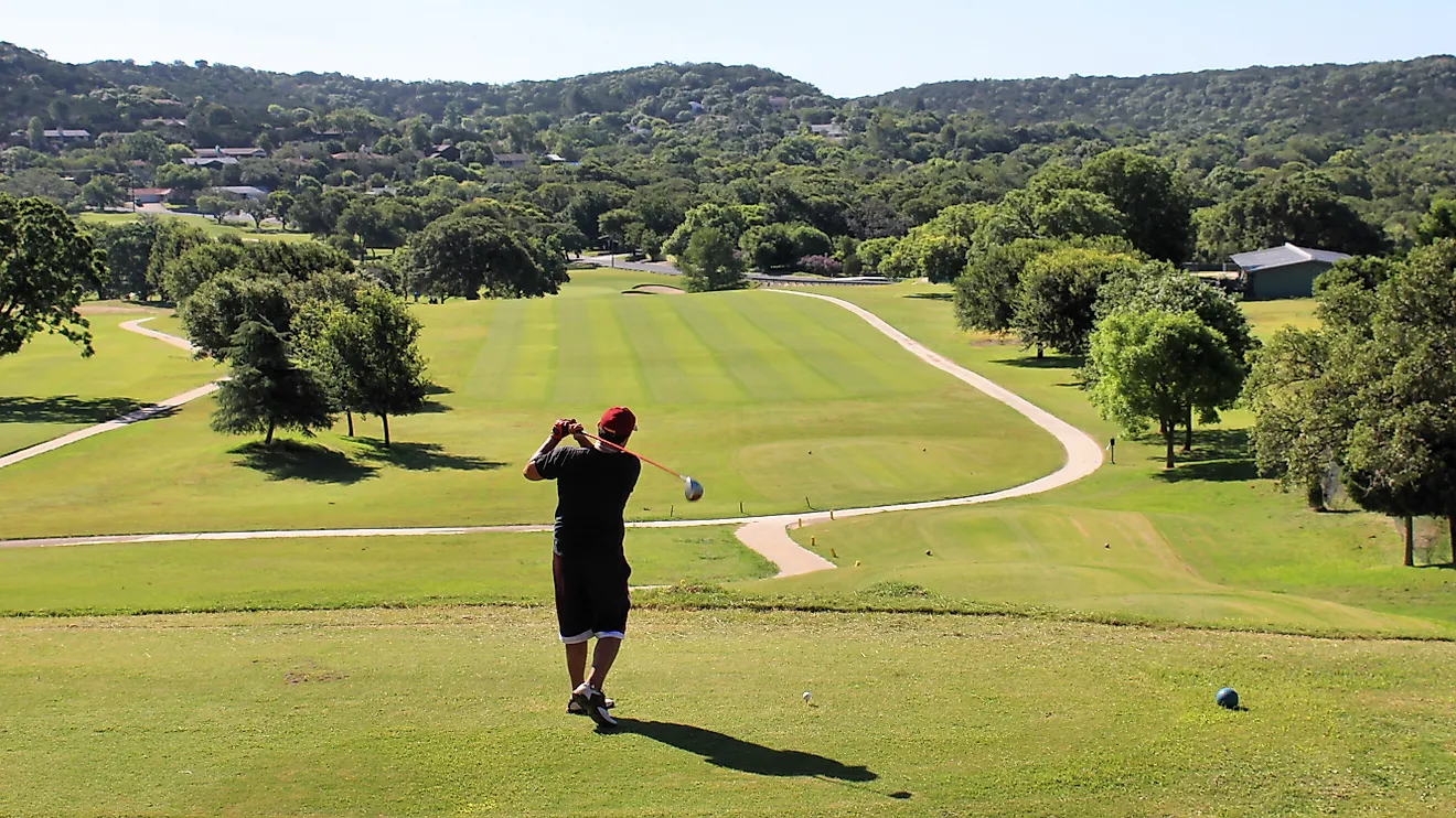 A golfer takes a practice swing at the Scott Schreiner Municipal Golf Course in Kerrville, Texas, United States.