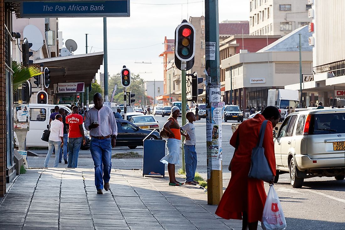 People on the city streets of Bulawayo, Zimbabwe. Editorial credit: Artush / Shutterstock.com.