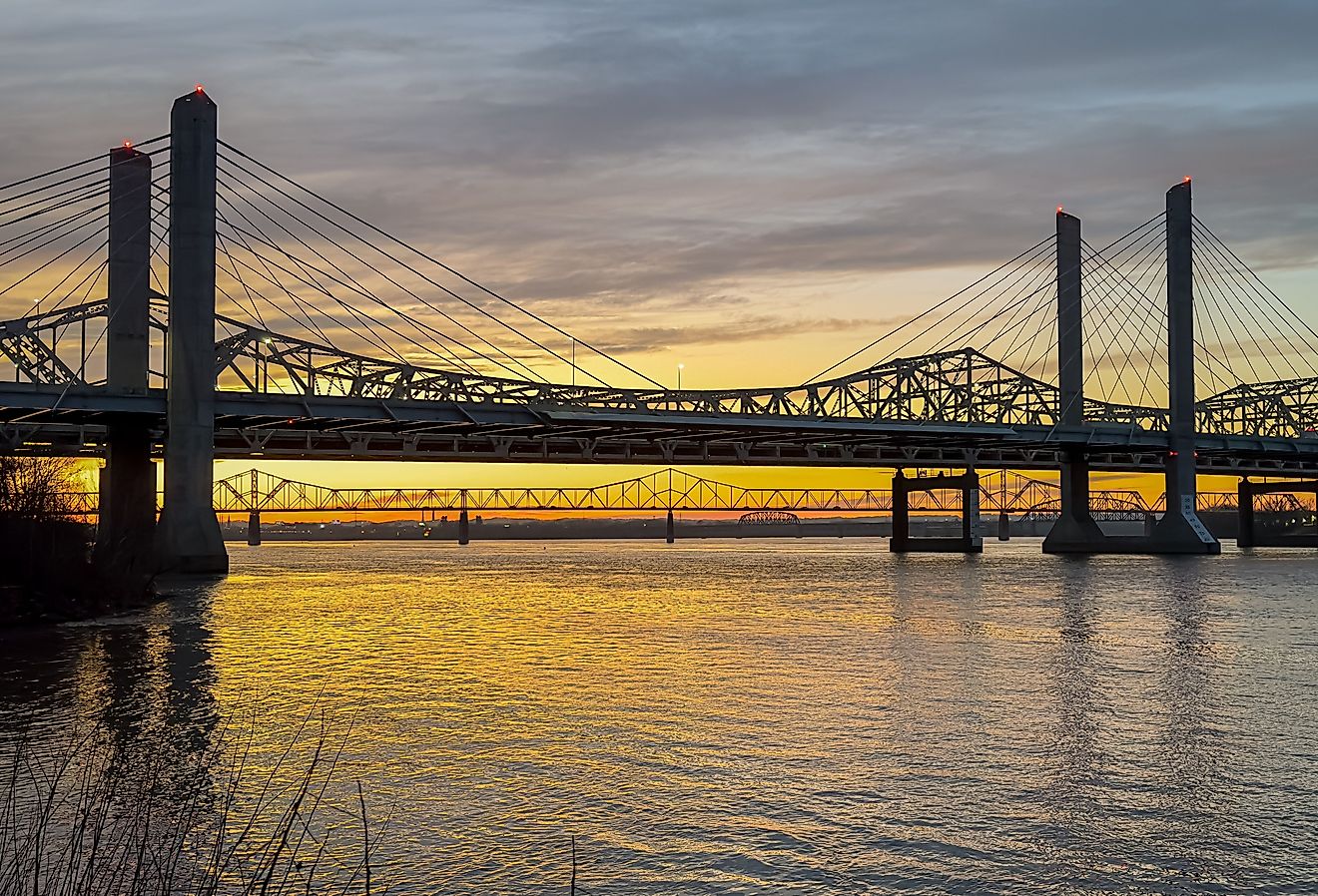 John F. Kennedy Bridge and Abraham Lincoln Bridge crossing the Ohio River between Louisville, Kentucky and Jeffersonville, Indiana at sunset. Image credit Carrie A Hanrahan via Shutterstock.