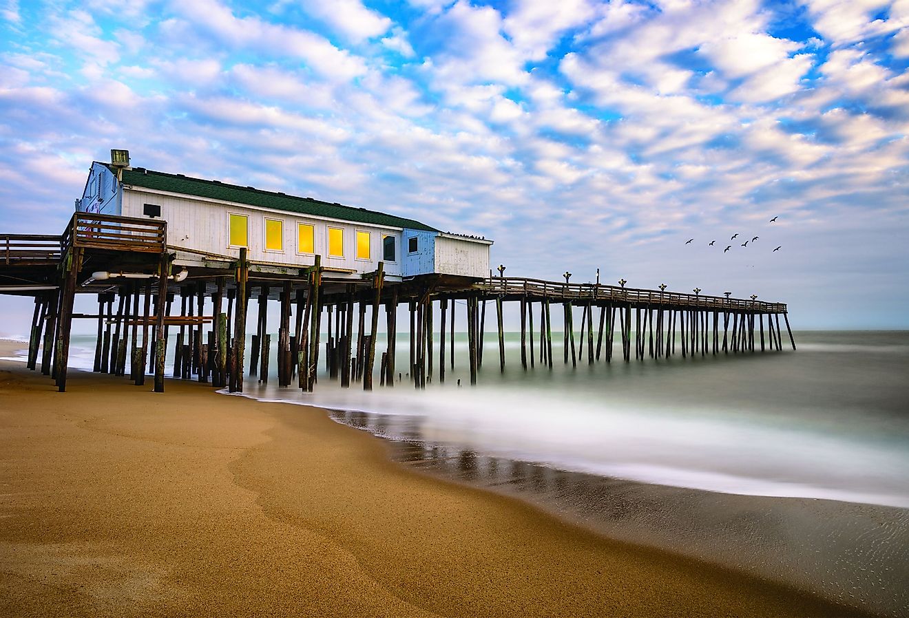 Morning time at Kitty Hawk fishing pier along North Carolina's Outer Banks. Image credit anthony heflin via Shutterstock.