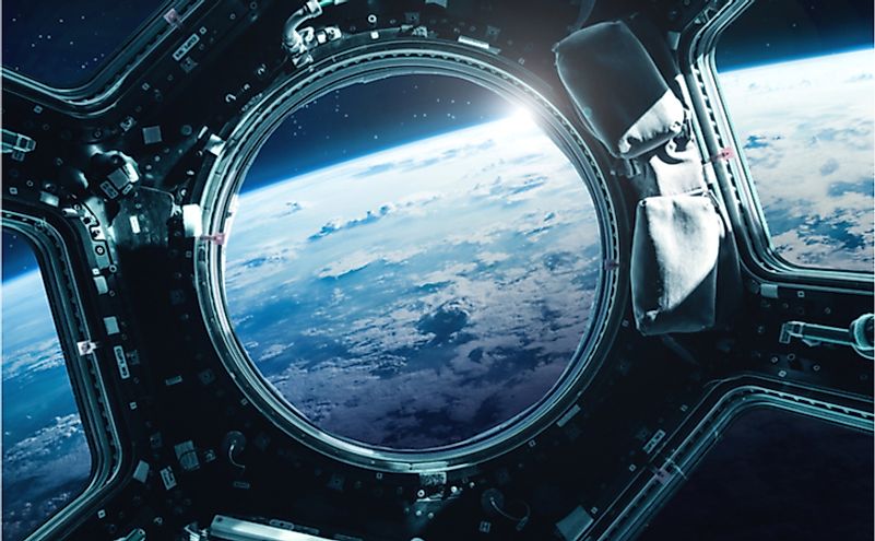 Porthole of space station near the Earth on the background. Elements of this image furnished by NASA.