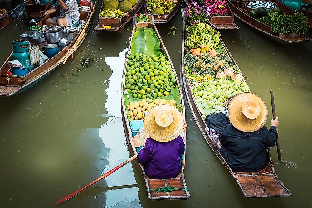 Vendors at a floating marketplace in Thailand. 