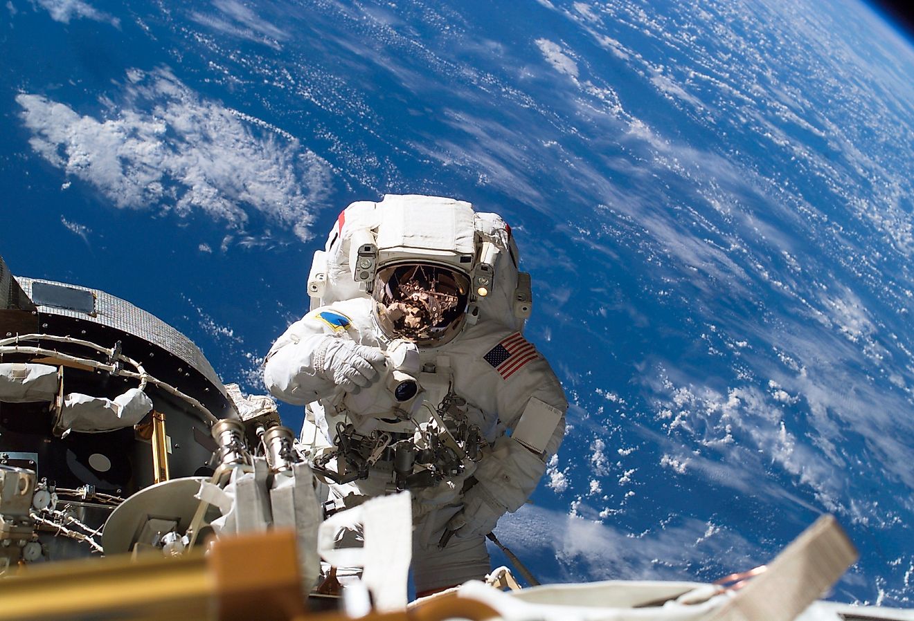 Astronaut Michael A. Lopez-Alegria pauses near the front of the International Space Station during an expedition. Via Shutterstock / RawPixel.com