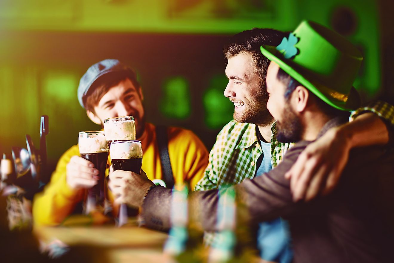 A group of friends celebrating St. Patrick's Day at a traditional Irish pub. Image credit: Pressmaster/Shutterstock.com