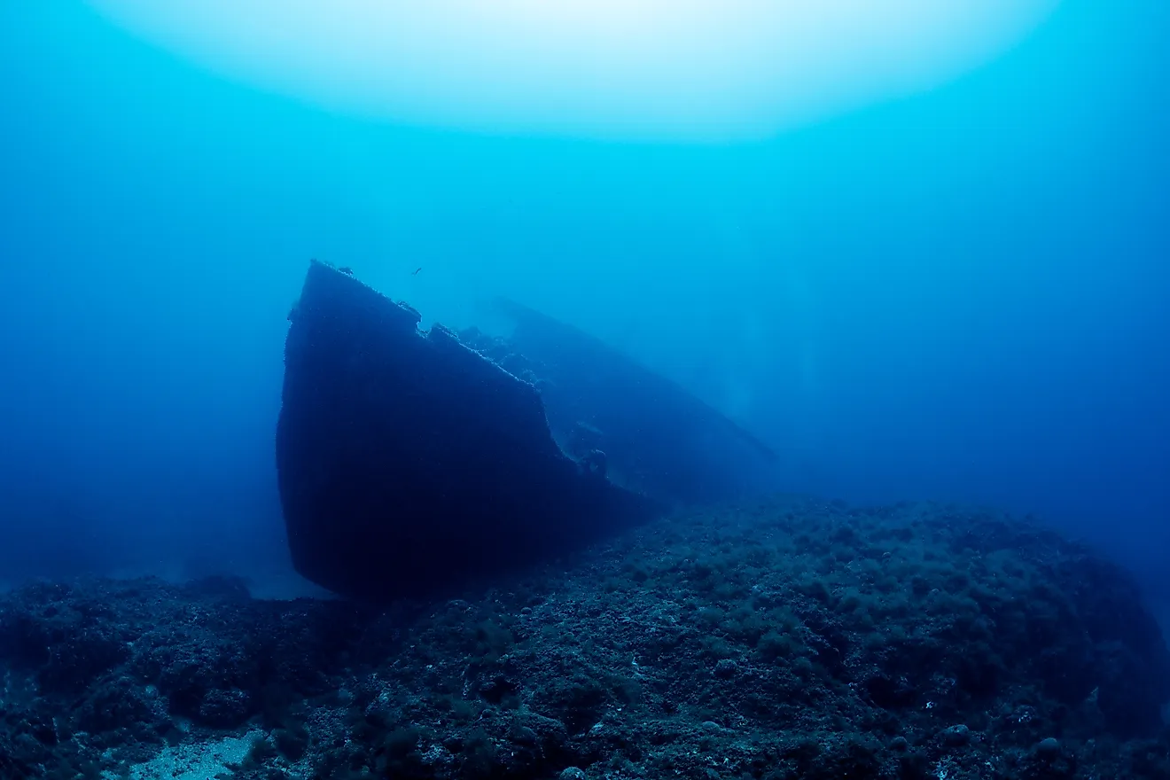 Wreck of an old ruined ship on ocean rocky bottom