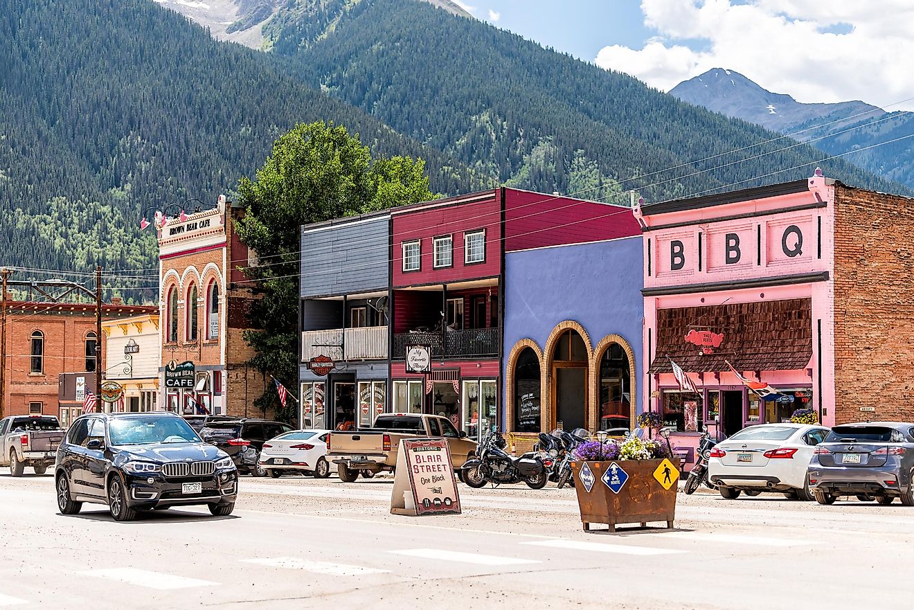 Silverton, USA - August 14, 2019: Small town village in Colorado with main road and colorful vibrant multicolored historic architecture houses and Blair street sign