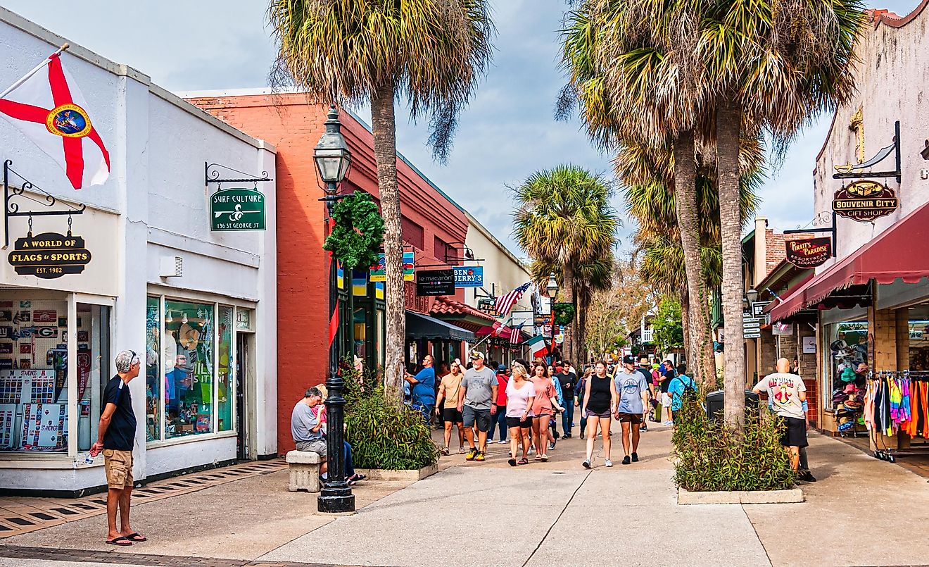 Saint Augustine, Florida- Large groups of visitors and tourists explore the array of shops near the end of Saint George street in Saint Augustine, Florida on an early January afternoon.