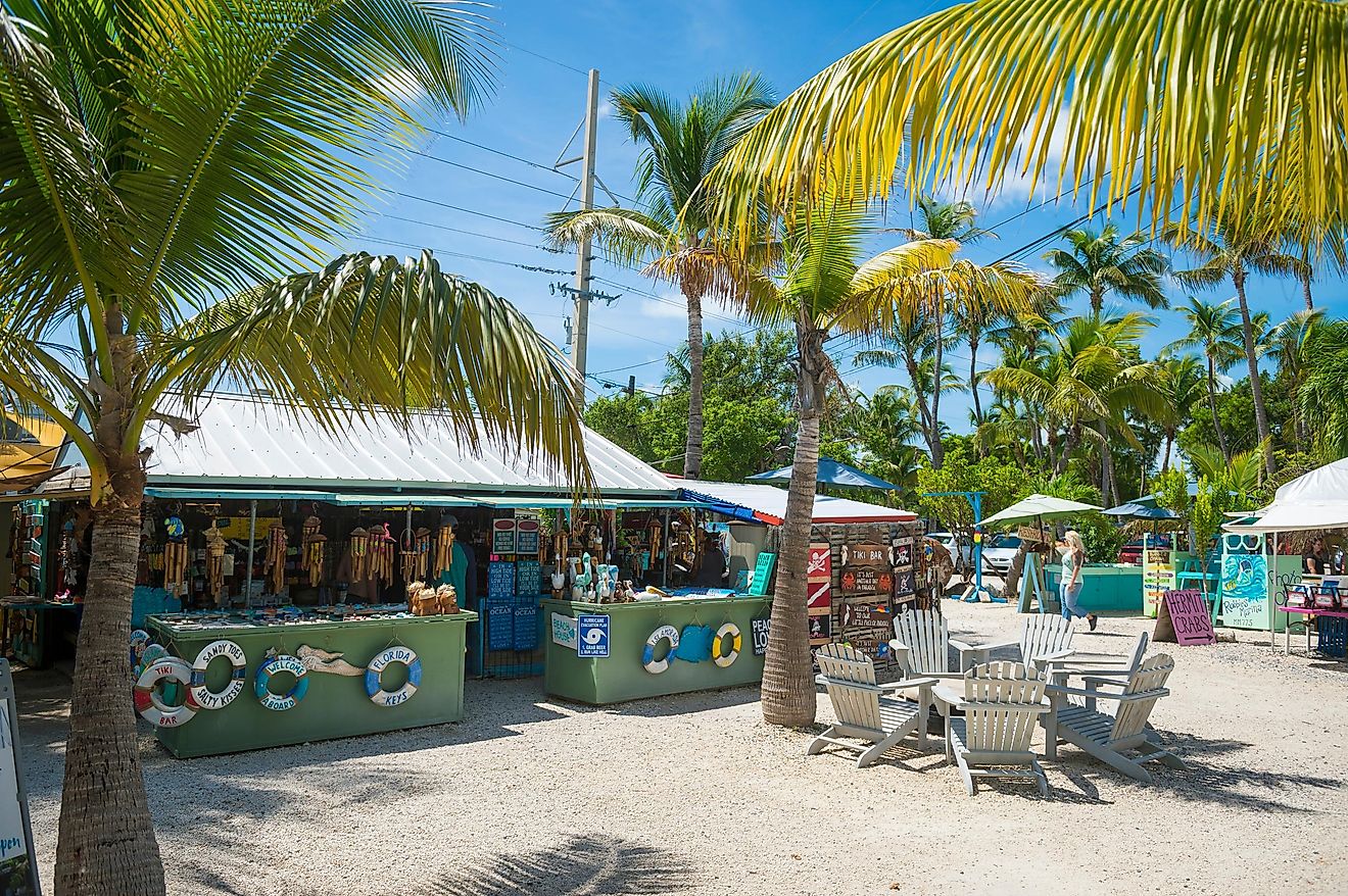 ISLAMADORA, FLORIDA, USA - SEPTEMBER, 2018: Colorful signs decorate shacks selling tourist souvenirs at a roadside shop in the Keys.
