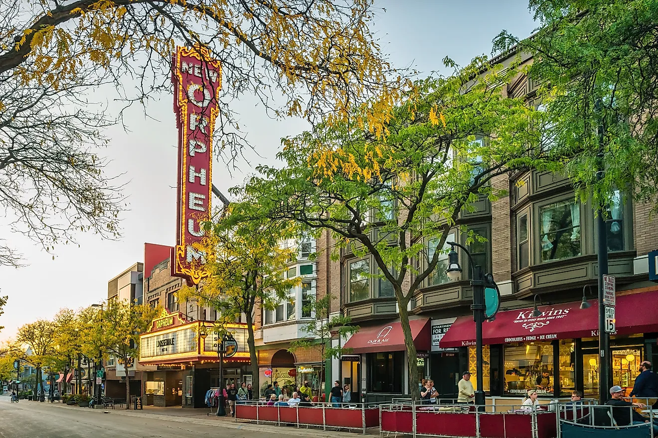 Iconic colorful tables and chairs overlooking sailboats on Lake Mendota at Union Terrace on the University of Wisconsin - Madison campus. Editorial credit: Koeppen Photo / Shutterstock.com