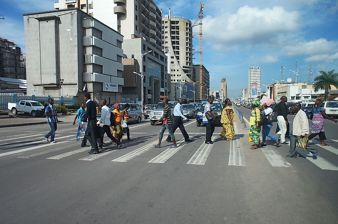 People crossing the street in Kinshasa, Democratic Republic of the Congo. Editorial credit: Alexandra Tyukavina / Shutterstock.com.
