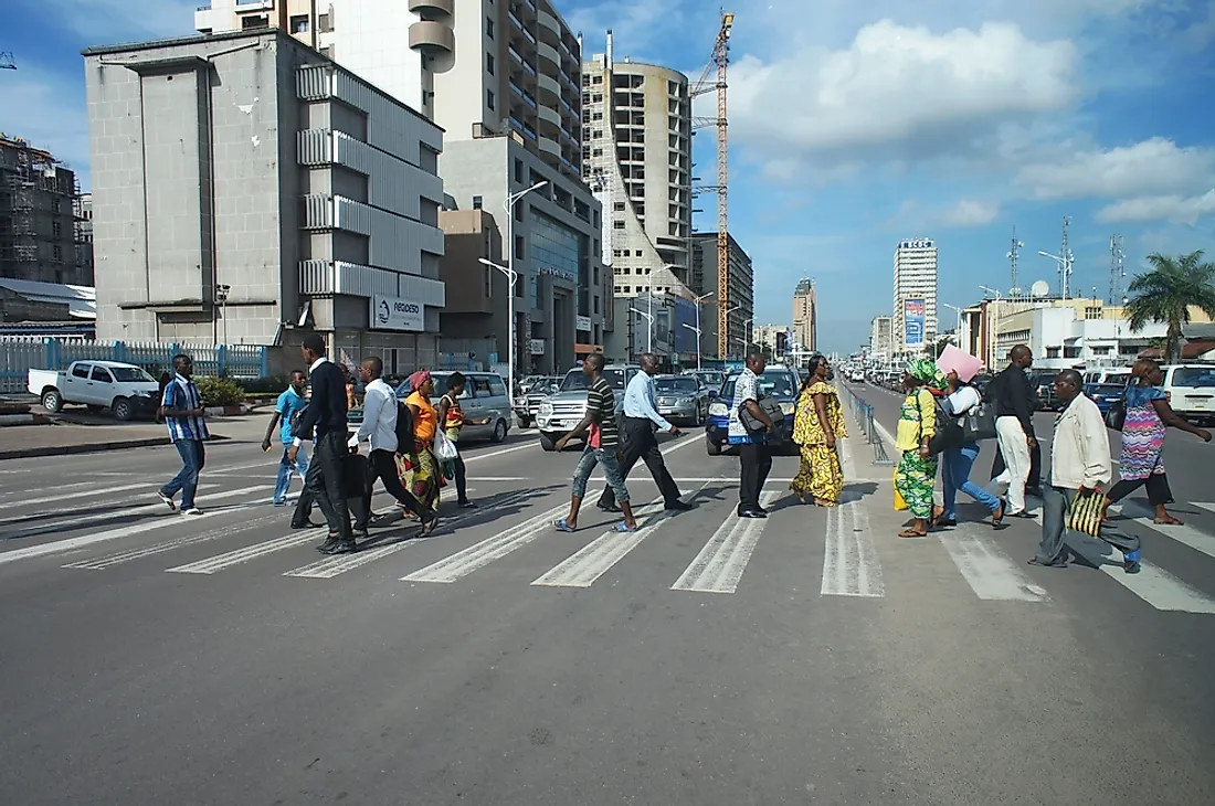 People crossing the street in Kinshasa, Democratic Republic of the Congo. Editorial credit: Alexandra Tyukavina / Shutterstock.com.